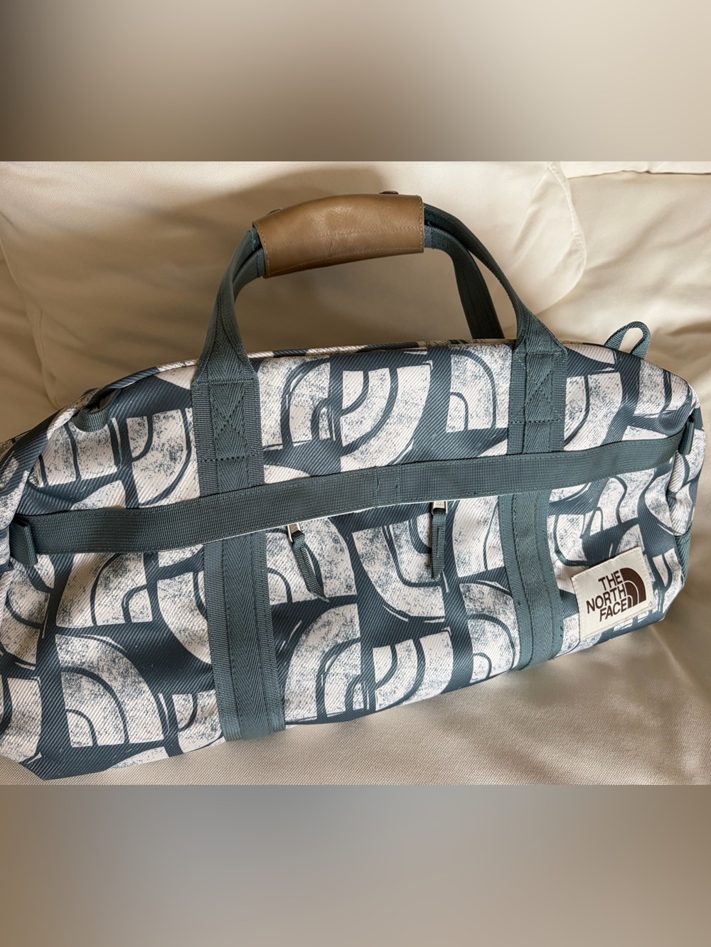 The North Face Teal and White Graphic Duffel Bag